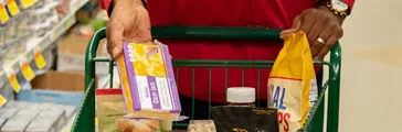 Shopping cart with packaged goods inside